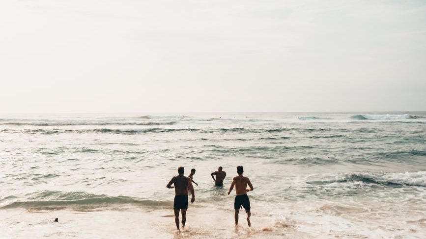 People playing in the ocean